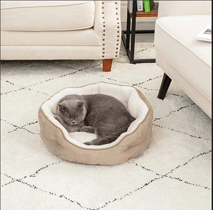 Create the ultimate cozy spot for your pet with this round small pet bed