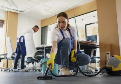 professional-cleaning-service-person-using-vacuum-cleaner-office-1