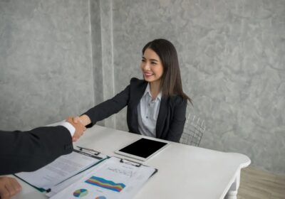 business-colleagues-talking-while-working-office