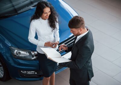girl-is-smiling-female-customer-modern-stylish-bearded-businessman-automobile-saloon-1