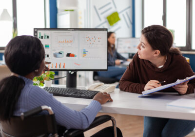 businesswoman-discussing-with-disabled-woman-1