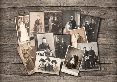 old-family-photos-laid-out-on-wo